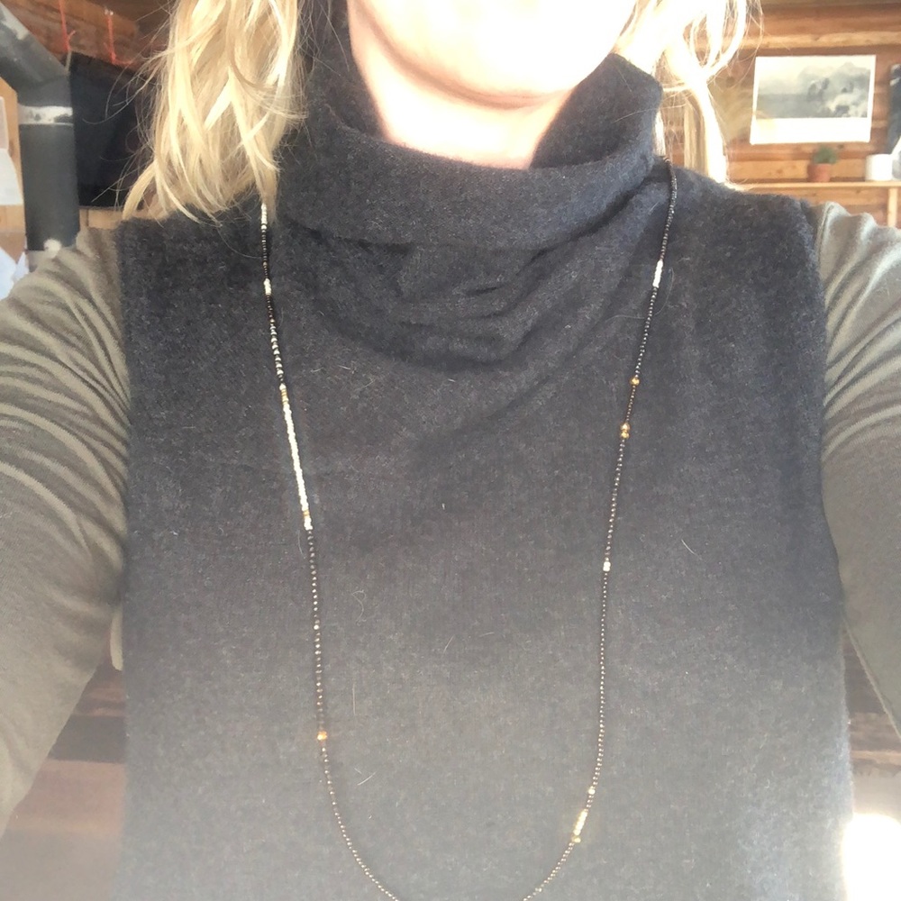 Long single-strand beaded necklace
